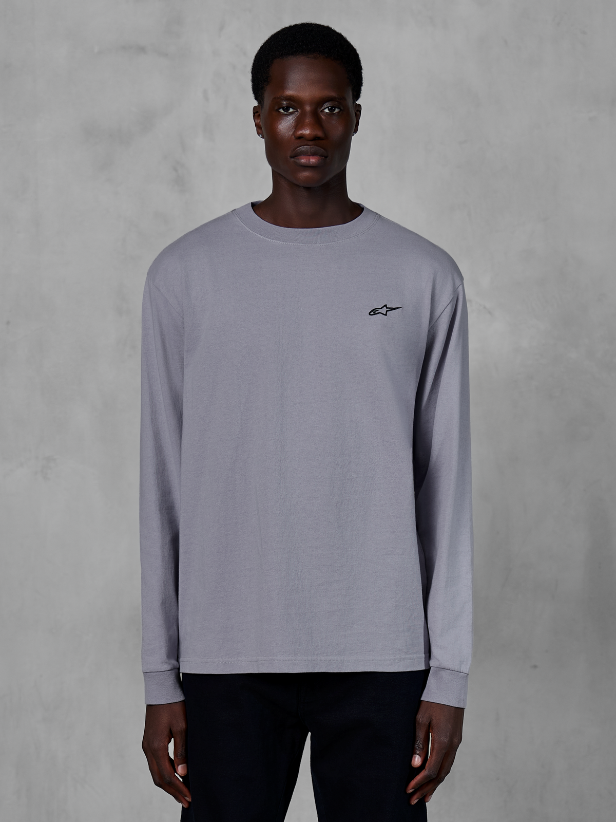 Alpinestars Essentials Ageless LS Tee, Long Sleeve T-Shirt, Silver, worn by a model, featuring a small black Alpinestars logo on the chest, relaxed contemporary fit, organic cotton casual streetwear