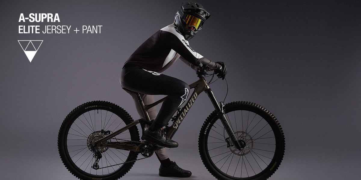 Alpinestars A-Supra Elite Jersey and Pant, black and white MTB gear for professional downhill mountain biking performance.