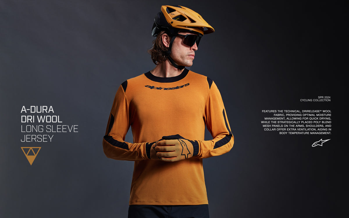 Alpinestars A-Dura Dri Wool Long Sleeve Jersey, men's MTB top in dark gold and black with breathable mesh for trail riding.