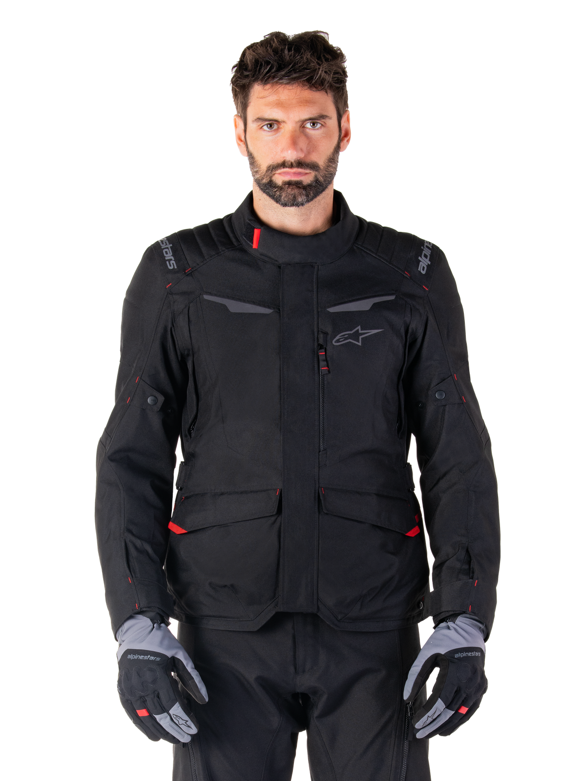 Alpinestars ST-1 Waterproof Jacket, Motorcycle Touring Jacket, Black with Red Accents, High Collar, Multiple Pockets, Textured Durable Material, Worn with Black Pants and Gray Gloves