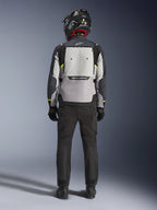 Alpinestars Cusco Drystar® Jacket, men's adventure touring motorcycle jacket in ice gray, mid gray, and deep gray, rear view showing a large back ventilation panel and Alpinestars branding worn by a model in matching gear