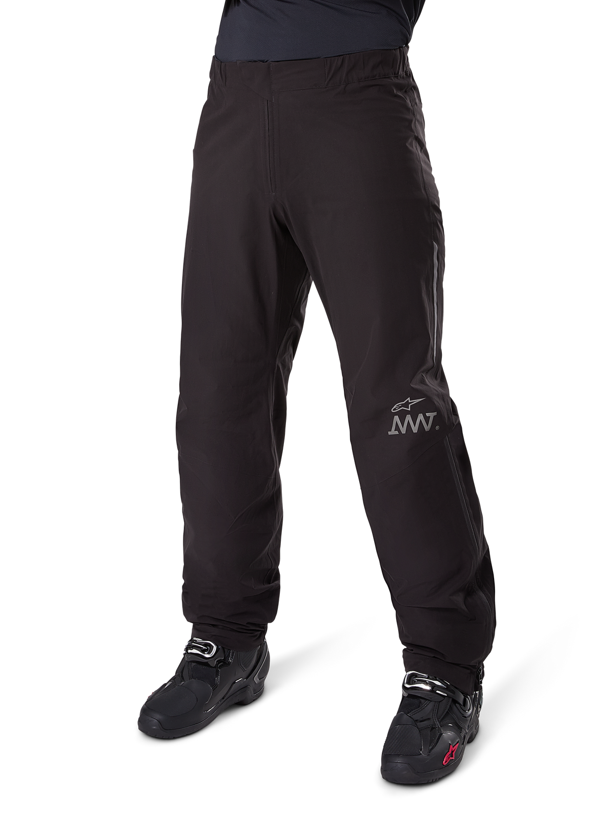 Alpinestars Amt 8 Stretch Drystar® XF Pant Liner, Waterproof Motorcycle Pants, Black, featuring a grey AMT logo on the lower left leg, worn with black motorcycle boots, functional design for all-weather adventure riding