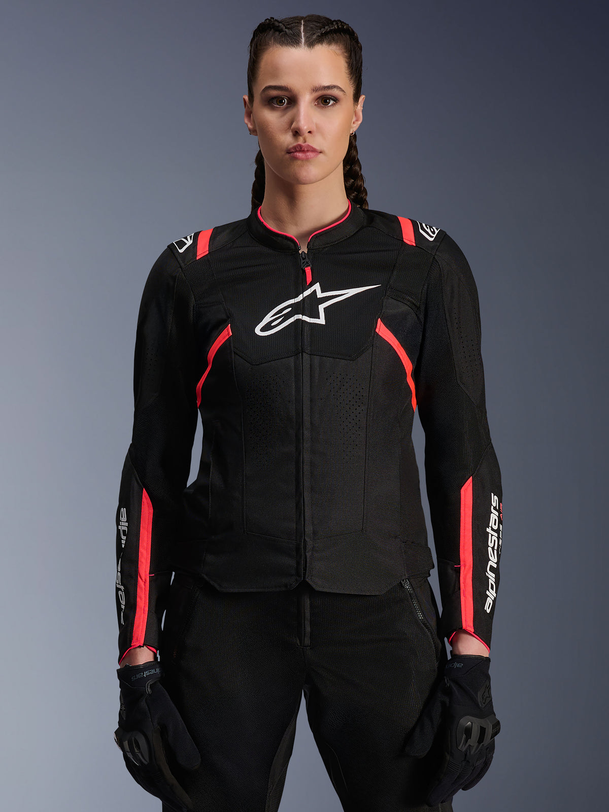 Alpinestars Stella T-SPS Air V2 Jacket, Women's Motorcycle Jacket, Black and Diva Pink, ventilated textile construction with white logo, pink racing-inspired accents on shoulders and sleeves, worn by a female model