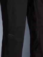 Alpinestars Flex-AST Canvas Pants, Urban Motorcycle Pants, Black, close-up of the knee area featuring pre-shaped panels and a subtle embroidered logo on durable canvas fabric.