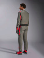 Alpinestars GP Race V3 Suit FIA, Anthracite Red racing suit, back view of model wearing the two-layer suit, red accents on shoulders and legs, paired with matching gloves and boots, professional auto racing gear