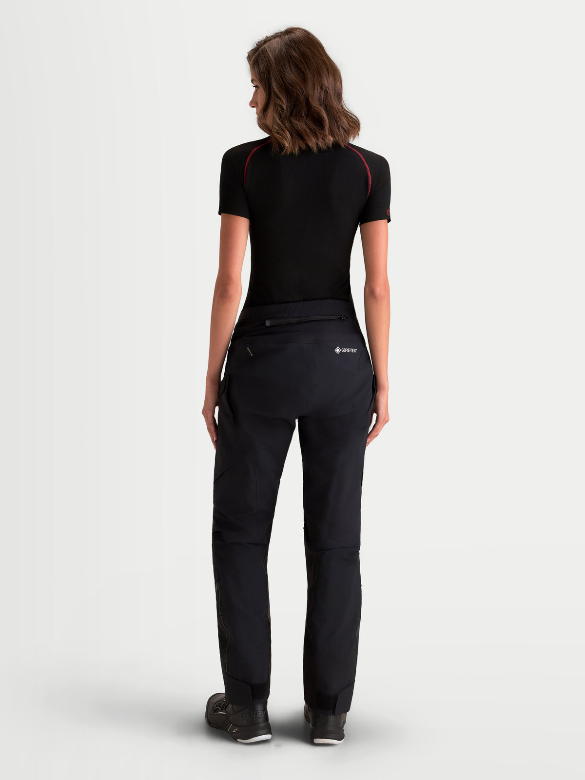 Alpinestars Stella St-7 V2 2L Gore-Tex Pants, women's adventure touring motorcycle pants in black, rear view on a model showing waterproof GORE-TEX textile construction and CE certified protection.