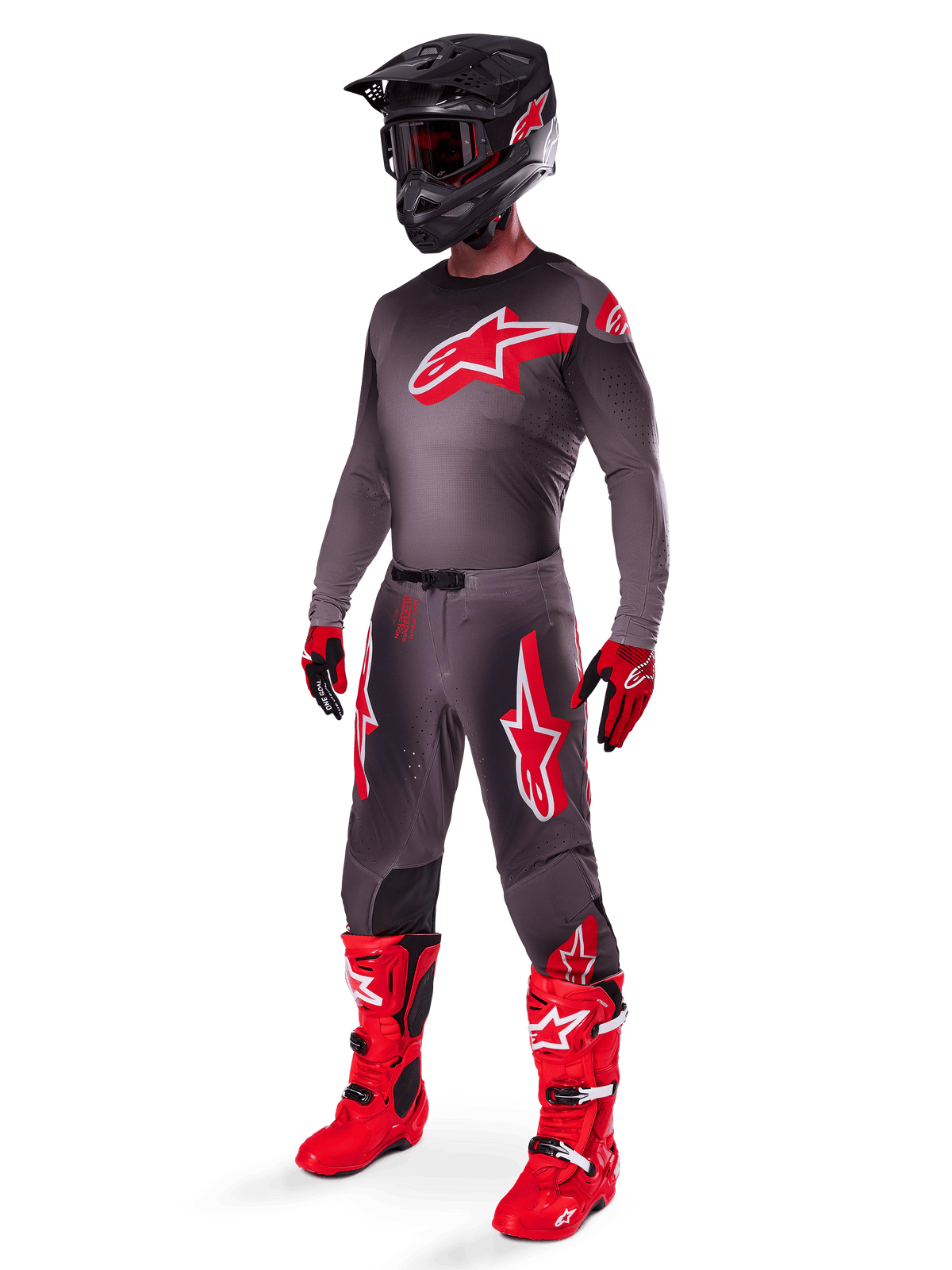 Alpinestars 2025 Supertech Lipan Gear Set, full motocross racing outfit, dark gray and red jersey with large star logo, matching pants with red accents and star graphics, red gloves, and bright red boots with white buckles, including a matte black helmet with red goggles.