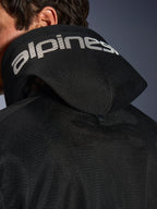 Alpinestars Chrome Superairflow Hoodie, Black, Detail view of the 3D mesh hood with white alpinestars branding across the top, showing the rear stabilization snap button, ventilated textile motorcycle gear for extreme heat