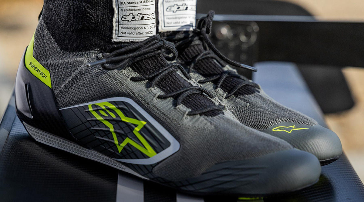Alpinestars Supertech Shoes, auto racing footwear in Gray and Fluo Yellow with fire-retardant knitted upper and FIA tag.