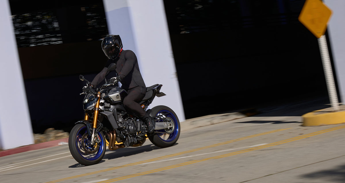 Alpinestars Celer Shoes, black motorcycle riding shoes worn by a rider on a sportbike for street performance.