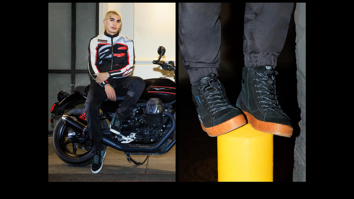 Alpinestars Stated Waterproof Shoes, urban riding sneakers in black and gum, worn by a model on a motorcycle.