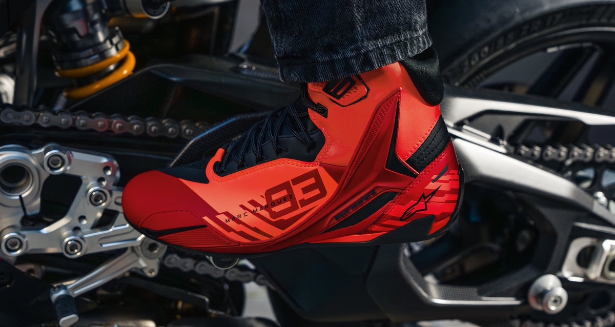 Alpinestars MM93 Reef V2 Gloves and Waist Bag collection gear includes this red and black Marc Marquez motorcycle shoe.