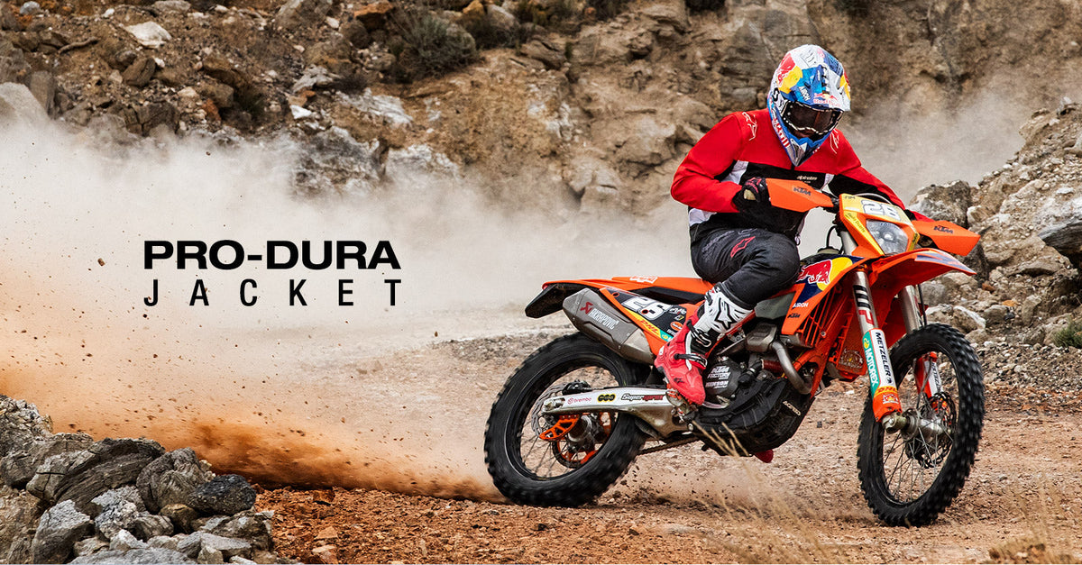 Alpinestars Pro-Dura Jacket, red and black textile enduro motorcycle jacket, worn by an off-road rider.