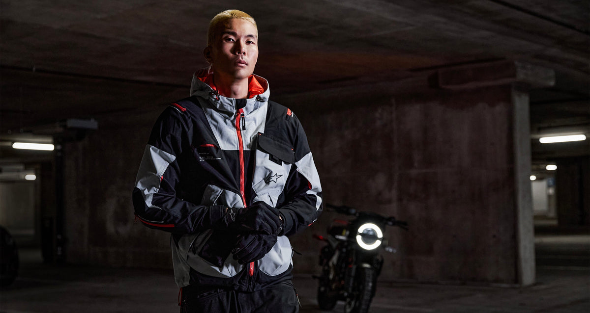Alpinestars Mogress Air Jacket, Men's urban motorcycle jacket in Black and White with Lime Punch accents, in a garage.