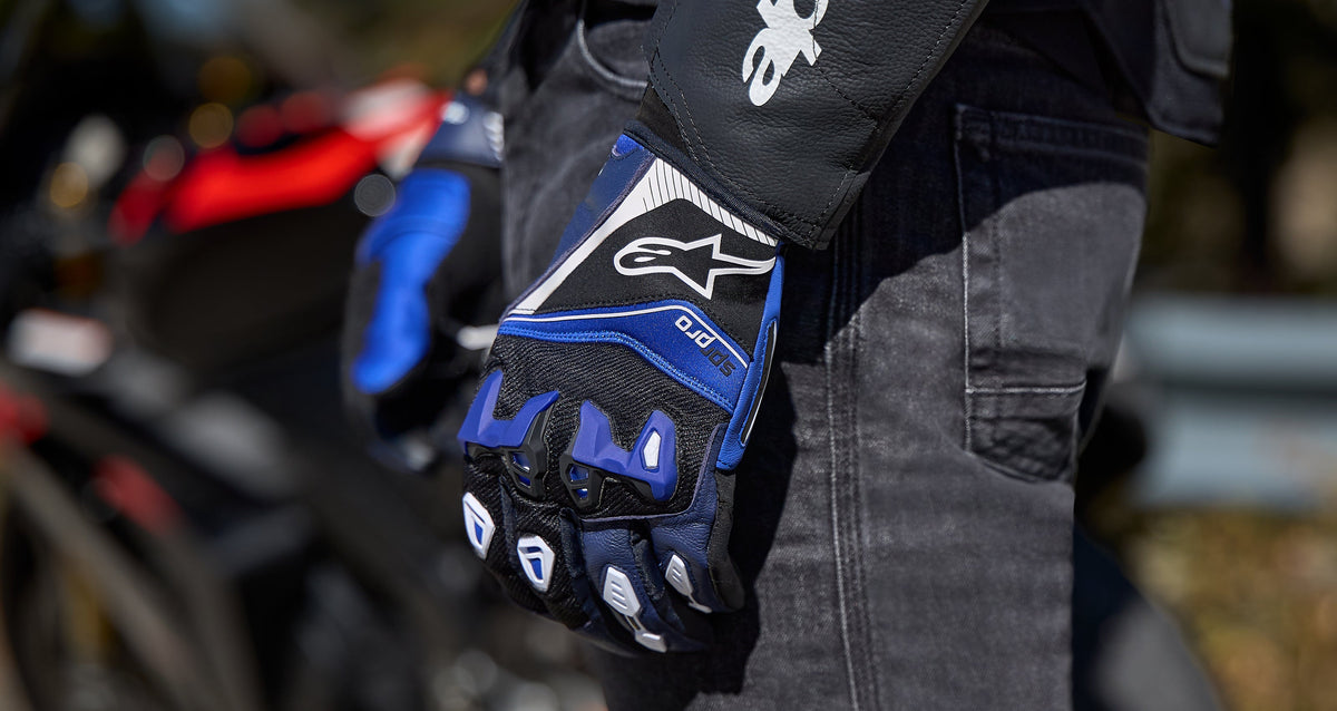 Alpinestars SP-R Pro Gloves in blue and black, short cuff sport motorcycle racing gloves with divided TPU knuckle protection.