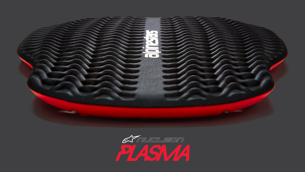 Alpinestars Nucleon Plasma protector, Black and Red impact armor for MTB and motorcycle with a wavy textured surface.
