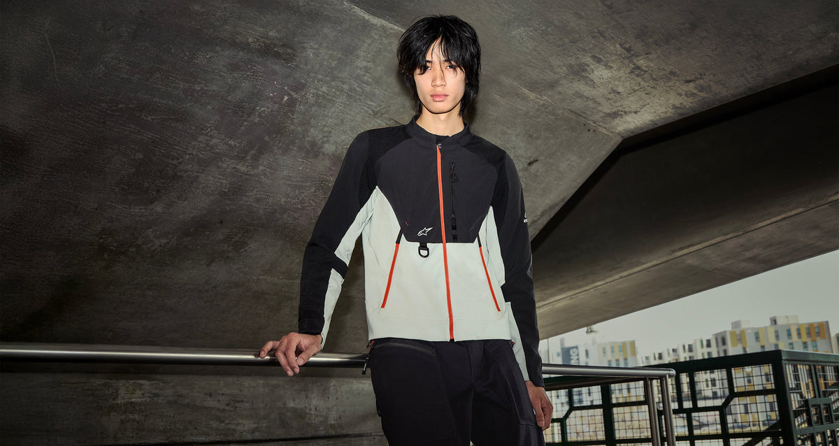Alpinestars Provoke Jacket, a men's urban motorcycle jacket in Black and Metal Gray with orange technical zipper details.