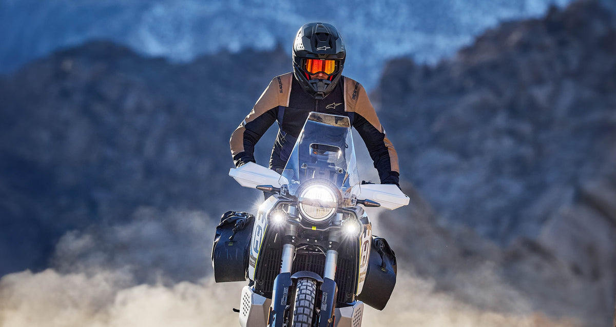 Alpinestars ST-2 Air Jacket, Men's Adventure Touring Motorcycle Jacket, Ice Gray and Black, on a rider in a rocky desert.