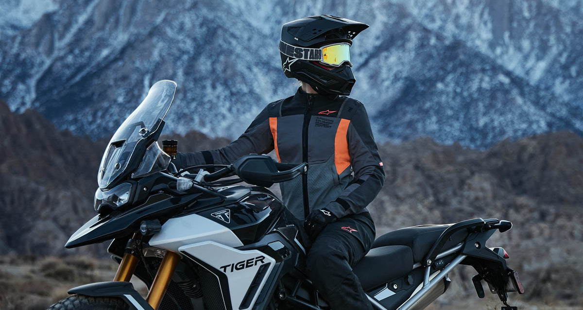 Alpinestars Stella ST-2 Air Jacket, women's adventure motorcycle jacket in Deep Gray and Fluo Coral with mesh panels.