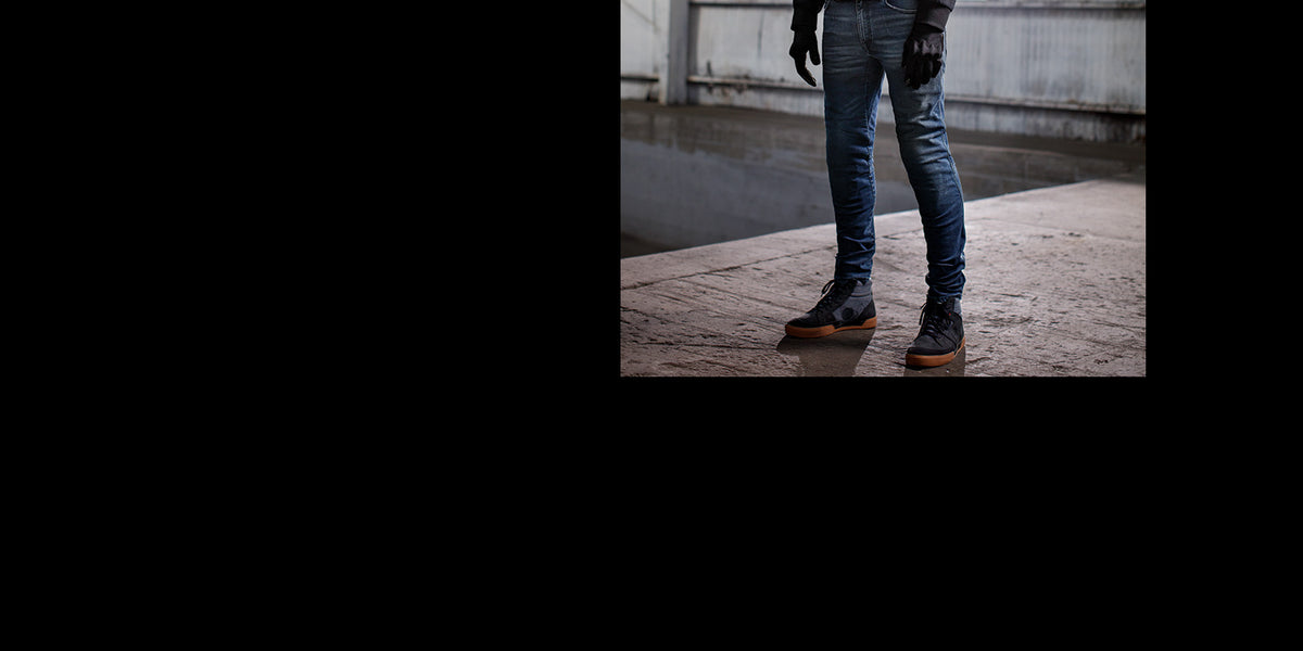 Alpinestars Radium Tech Hoodie urban riding outfit, featuring blue denim and black motorcycle sneakers.